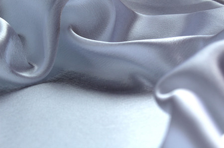 soft waves white drapery of satin fabricの写真素材