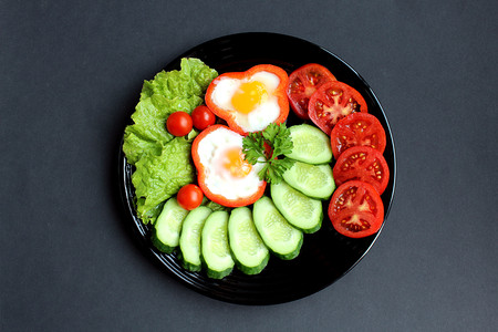 easy breakfast fried egg and fresh vegetablesの写真素材