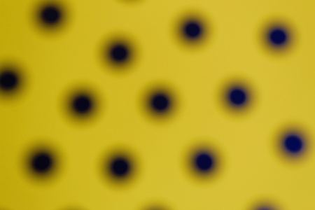 texture yellow blurry background with black circlesの写真素材