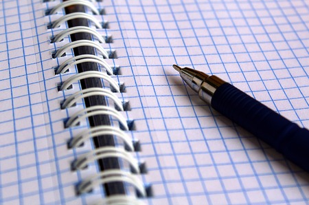 notebook with blue penの写真素材