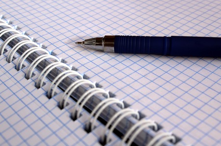 notebook with blue penの写真素材