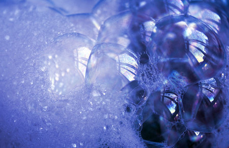 Transparent soap bubbles of a blue shade