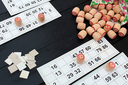 Board game lotto with cards and wooden kegs