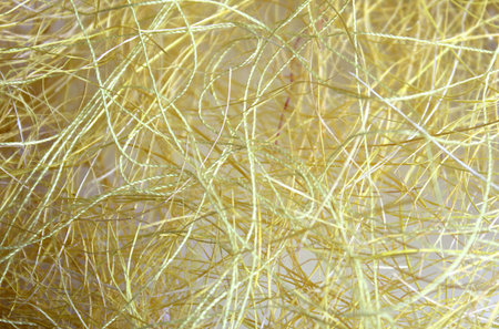 defocused texture tangled yellow thread background abstraction