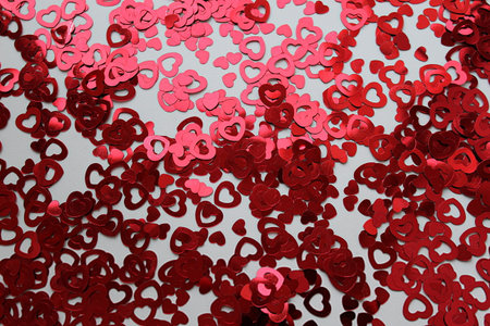 Texture red hearts on a red background