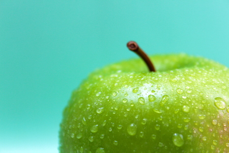 Green apple with water dropsの写真素材