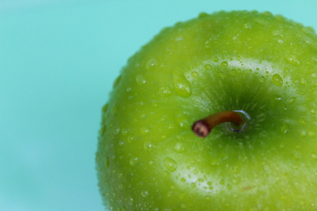 Green apple with water dropsの写真素材