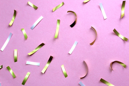 Texture festive confetti scattered on lilac backgroundの写真素材