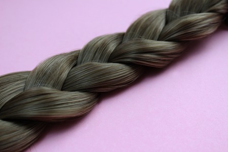 Texture close-up of braided hair gray color backgroundの写真素材