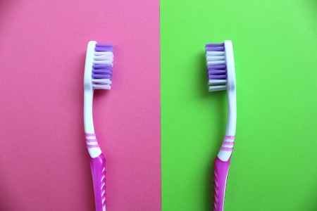 Two toothbrushes are different backgroundの写真素材