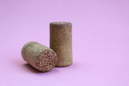 wine cork two pieces on a pink backgroundの写真素材