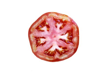 Slice of tomato isolated on white background. Top view, flat lay.の写真素材