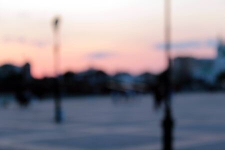 blurred square background in the city with people restingの写真素材