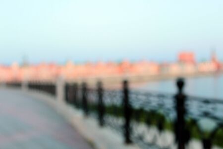 Blurred background. Evening city embankment riverbank.の写真素材