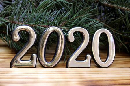 the background of a spruce branch are numbers 2020の写真素材