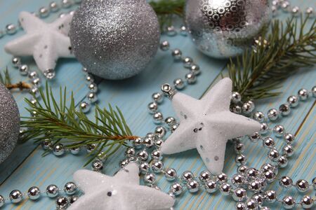 background star, garland, Christmas ball and fir branches on a wooden backgroundの写真素材