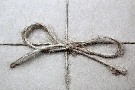brown rope bow background on brown paperの写真素材