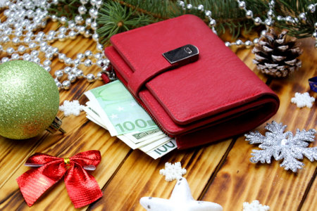 Red wallet with money on christmas backgroundの写真素材