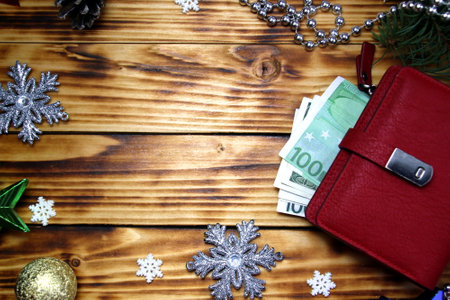 Red wallet with money on christmas backgroundの写真素材