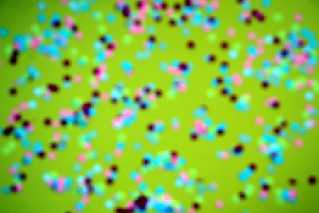 blurred photo background with circles of different colors on a green background