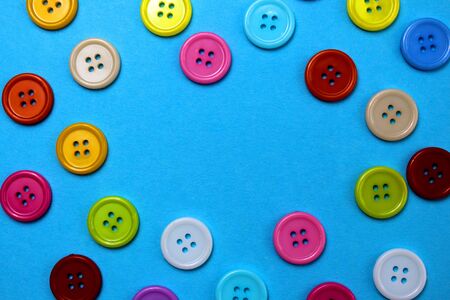 Multi-colored buttons laid out in the form of a frameの写真素材