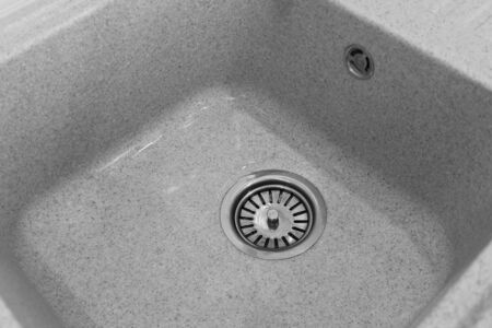 Gray sink in the kitchen for washing dishes and productsの写真素材