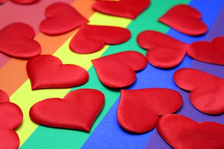 Rainbow homosexual color background with red heartsの写真素材