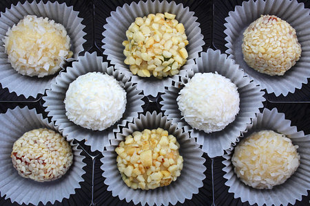 Candy background with coconut and nuts in packing