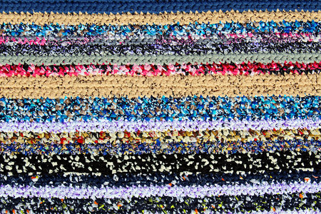 Horizontal pattern of different colors knitted rug