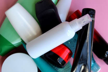 A bunch of plastic bottles with cosmetic creams and lotionsの写真素材