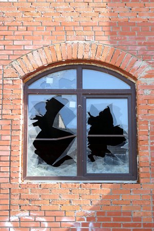 Broken new plastic window with vandals, broken glass