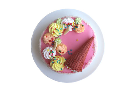 Round cake on a plate on a white background