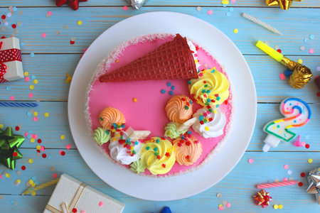 Holiday cake on the table with different little things for the holiday