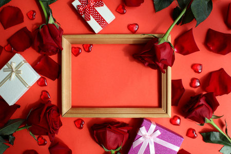 Wooden frame with red roses and heartsの写真素材