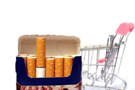 A pack of cigarettes on the background of a shopping cartの写真素材