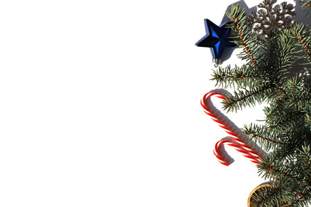 Fir branches with Christmas decorations lie on a white background with place for text