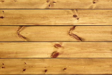Texture of wood planks with light brown knots