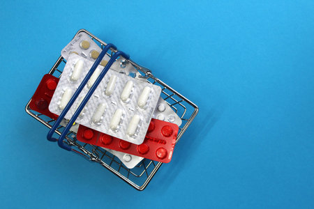 There are a bunch of treatment pills in the shopping cartの写真素材