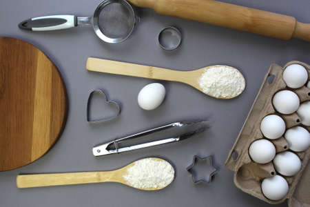 Kitchen utensils for making cookies lie on a gray backgroundの写真素材