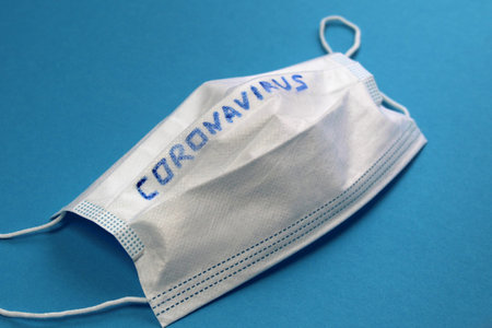 Coronavirus is written on the medical mask.