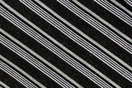 Black fabric texture with diagonal silver stripes