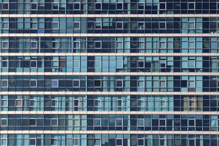 Texture of panoramic windows in a tall house with a turquoise hue.のeditorial素材