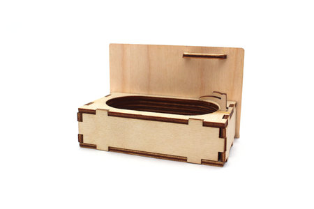 Wooden children`s toy bathtub assembled from plywood on a white isolated background.