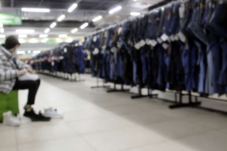 Blurred photo of a shop with shoes. Big mall.の写真素材
