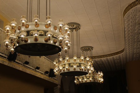 A large vintage chandelier hangs from the ceiling.