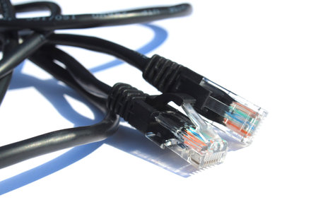 The black cable for connection lies on a white isolated background.