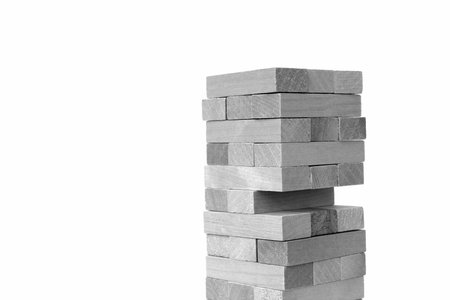 Wooden toy for building a tower from cubes.