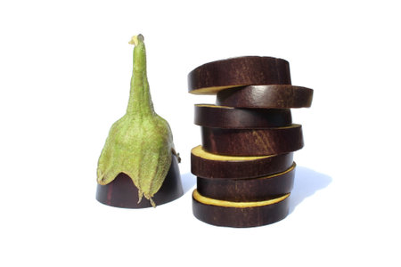 Sliced eggplant in circles lies on a white background.の写真素材