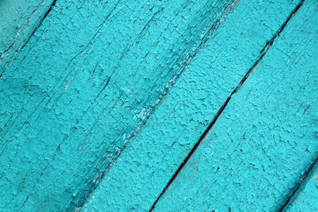Texture of painted wood with old cracked turquoise paint.の写真素材