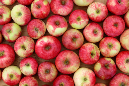 Background of red apples lying in a big pile.